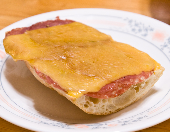 Open Faced Sandwich of Dry Salami and Sharp Cheddar