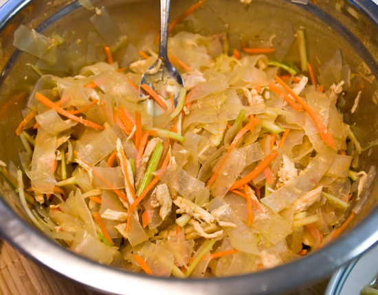 Mung bean noodles served cold with a mildly spicy sauce, carrots, celery, and shredded chicken