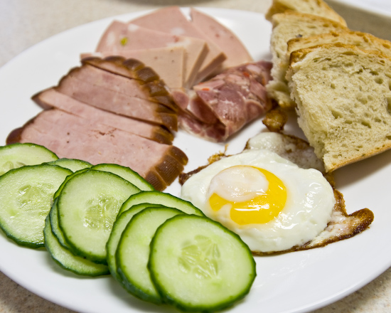 Cold cuts and an egg sunny side up