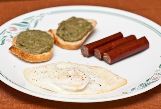 Fried egg, beef snack sticks, baba ghanoush on baguette