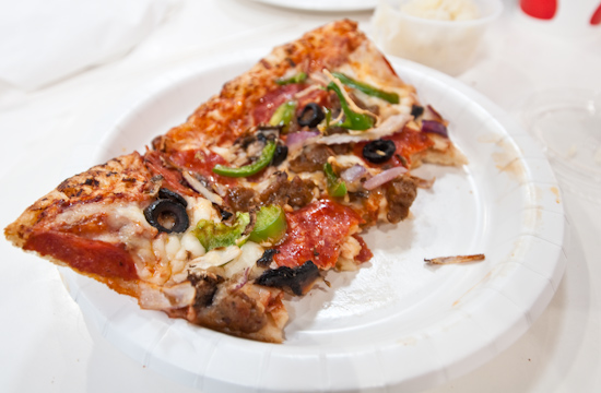 Costco - Half Eaten Combination Pizza Slice
