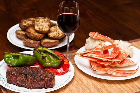 Surf and Turf Dinner: US Wellness Meats New York Strip Steak, Grilled Peppers, Red Potatoes, and Snow Crab Clusters