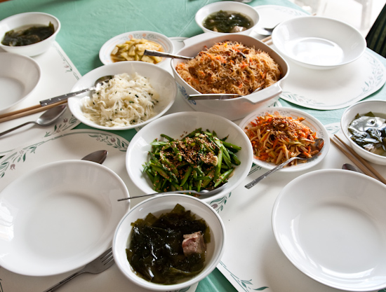 stir-fried rice noodles, asparagus, pork ribs and seaweed (konbu) soup, bean curd with carrots, pickled cucumbers, and vinegared potatoes