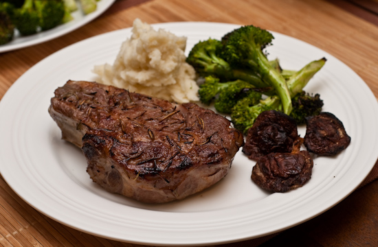 Garlic and rosemary veal rib chop with mashed potatoes, grilled broccoli, and grilled shiitake mushrooms