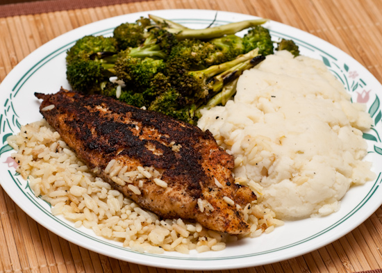 Leftover blackened catfish with rice pilaf, grilled broccoli, and mashed potatoes