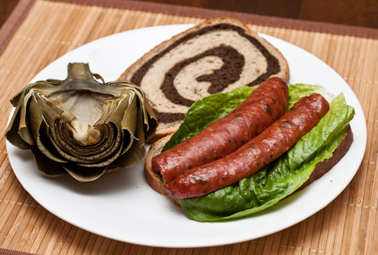 Half Artichoke and Sandwich of Leftover Rudy's BBQ Sausage