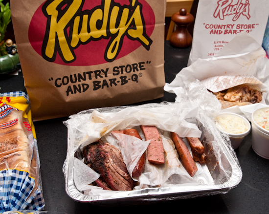 Rudy's BBQ - 1 lb moist brisket, 2 lb pork ribs, 1 jalapeno sausage, 1/2 chicken, potato salad, and cole slaw