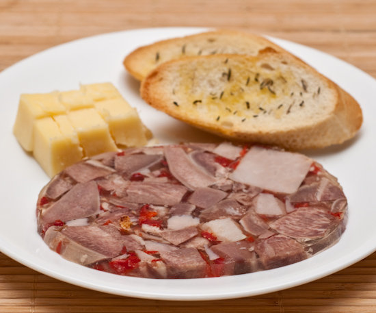 cheddar cheese (aged four years), head cheese, and toasted slices of French bread