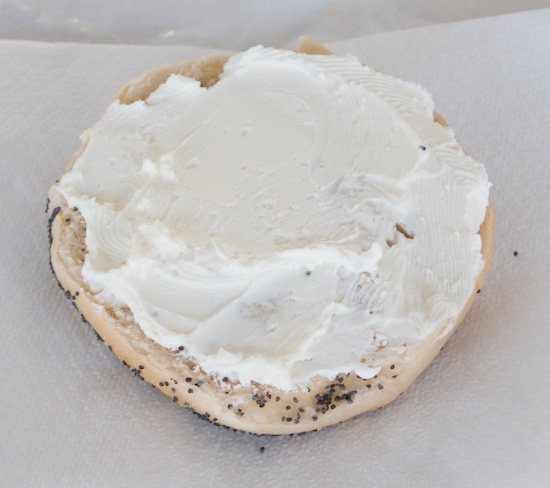 Half a Poppy Seed Bagel with Cream Cheese