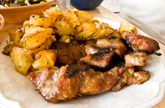 Roasted potatoes with oven-baked pork strips