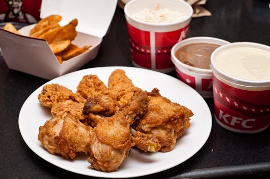 KFC - 10 pieces original recipe, mashed potatoes, cole slaw, potato wedges, and hot wings