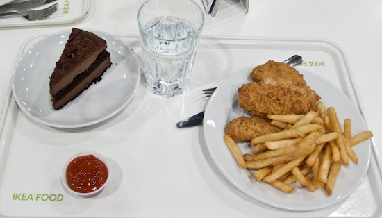 IKEA - chicken tenders with fries, and a slice of chocolate cake