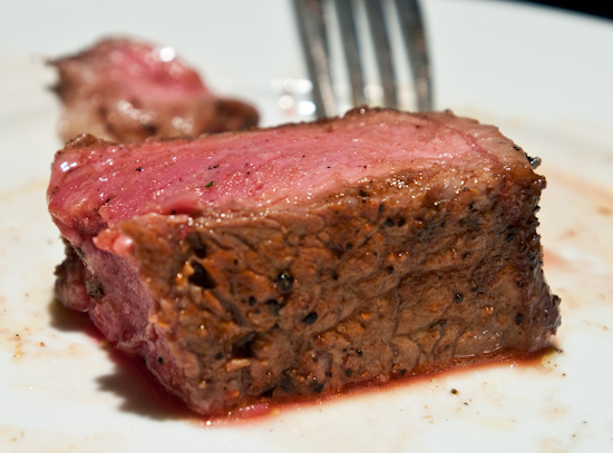 Austin Land & Cattle Company - Medium Rare slice of NY Strip Steak